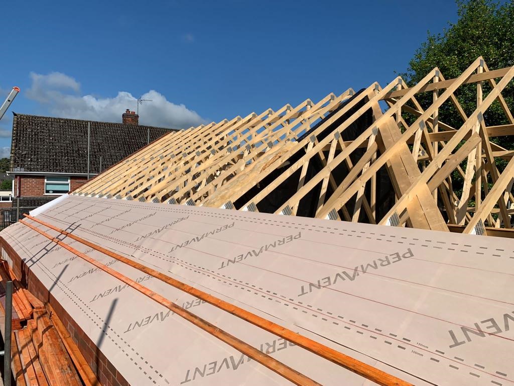 New Roof Trusses on new build housing development ready for roof lath and felting