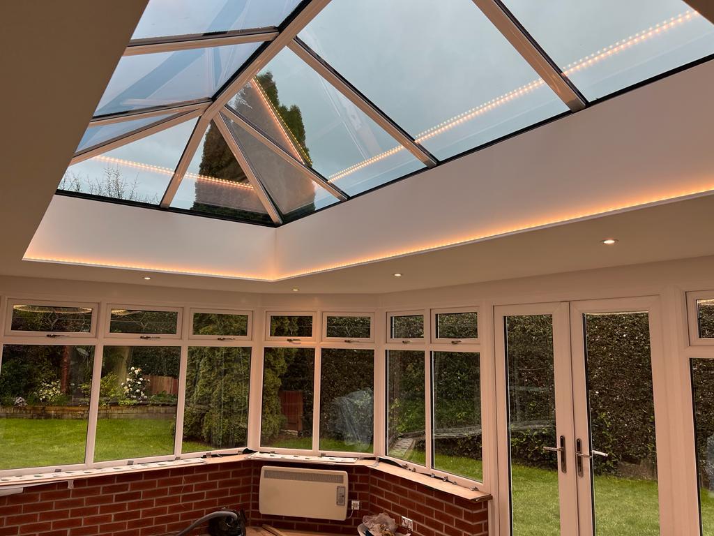 Large glass roof lantern installed in modern conservatory extension in Shropshire